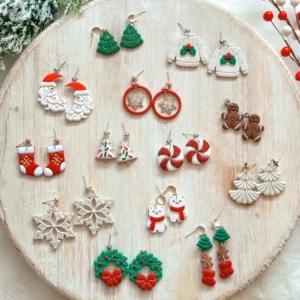 Handcrafted Christmas earrings on wood: Santa, trees, sweaters, gingerbread, candy canes, snowflakes, wreaths.